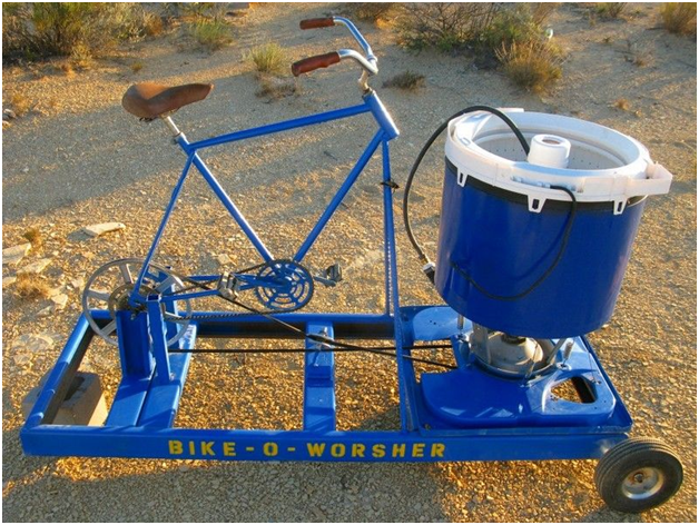 Make a camp washing machine using bucket and plunger